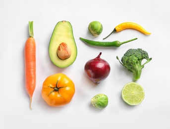 Fresh vegetables and fruits on white background, top view