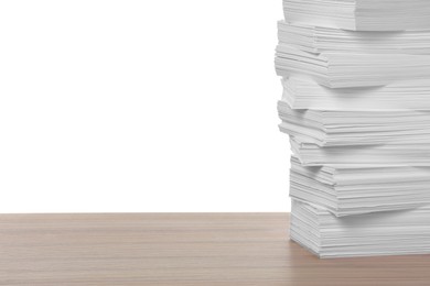 Stack of paper sheets on wooden table against white background. Space for text