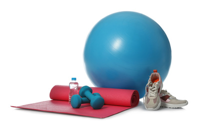 Photo of Fitness ball, bottle of water and sport accessories isolated on white