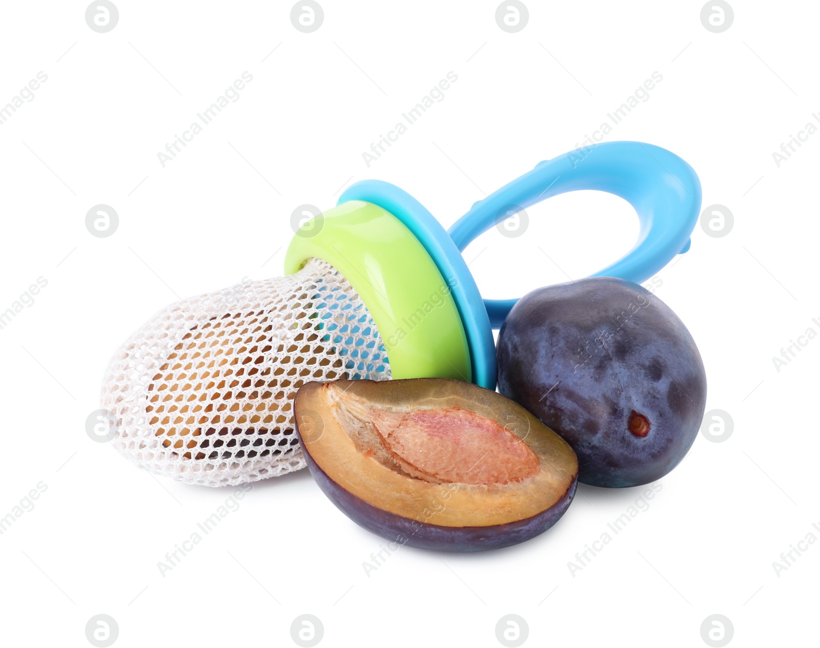 Photo of Nibbler with fresh plum on white background. Baby feeder