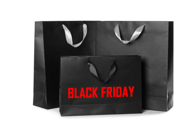 Image of Paper shopping bags on white background. Black friday