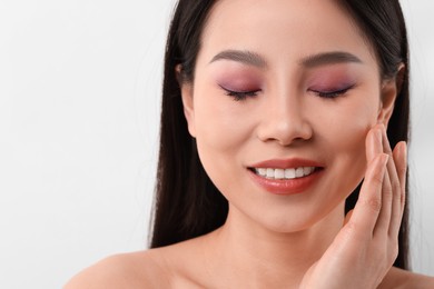 Portrait of beautiful woman on white background