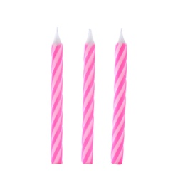 Photo of Pink striped birthday candles isolated on white