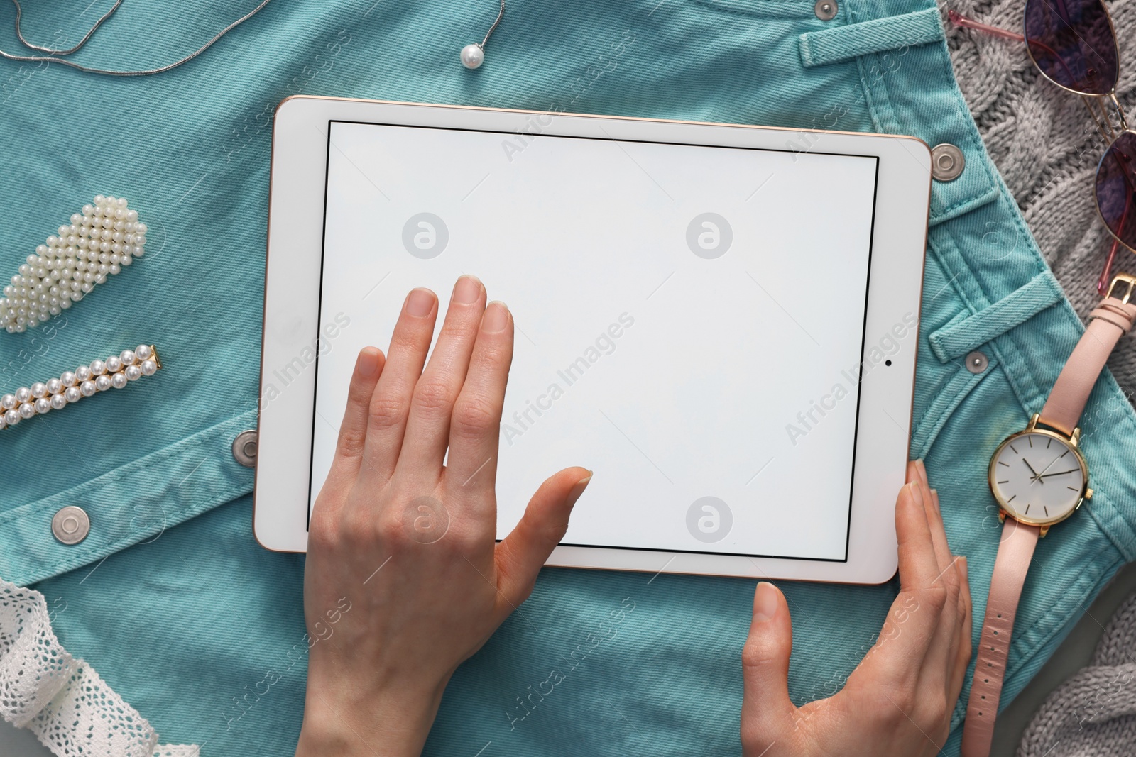 Photo of Woman with modern tablet at table, top view. Space for text