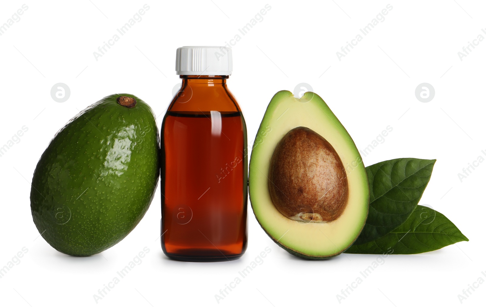 Photo of Bottle of essential oil, avocados and leaves on white background
