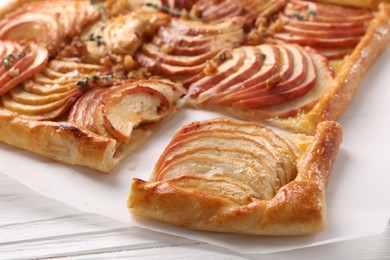 Photo of Freshly baked apple pie on white wooden table, closeup