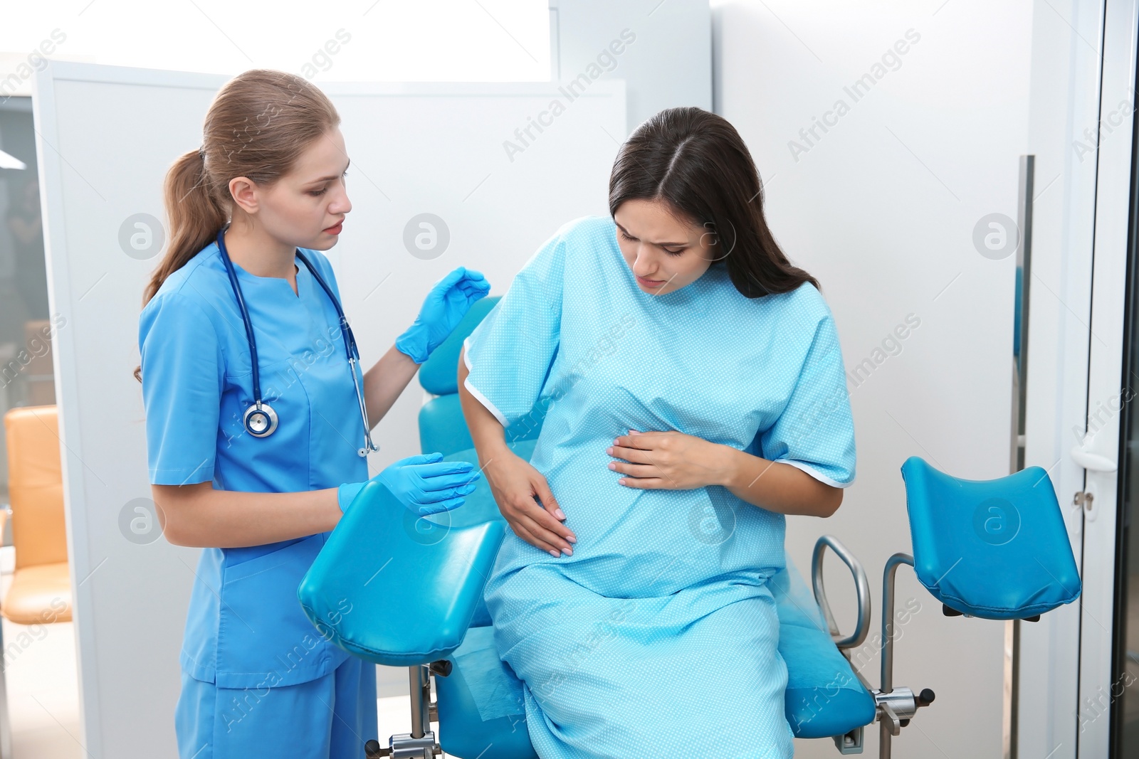 Photo of Pregnant woman having appointment at gynecologist office