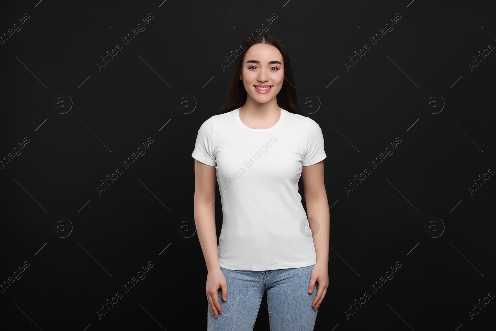 Photo of Woman wearing white t-shirt on black background