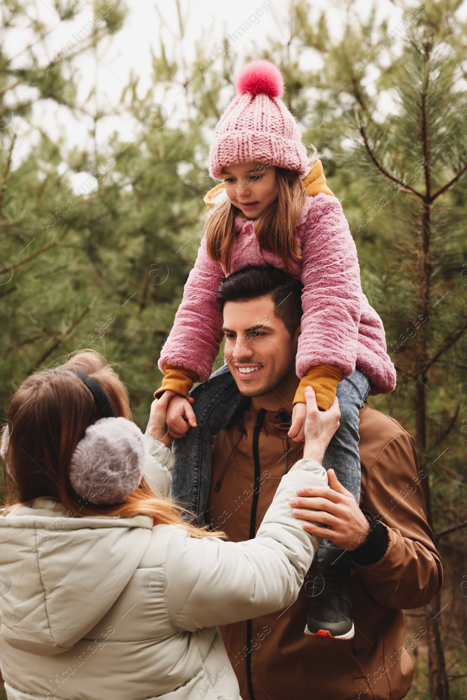 Photo of Happy family spending time together in forest