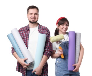 Photo of Couple with wallpaper rolls and roller on white background