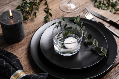 Elegant festive table setting on wooden background