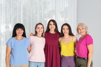 Photo of Group of ladies near window indoors. Women power concept