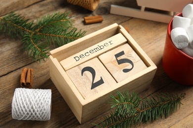 Photo of Composition with wooden block calendar on table, closeup