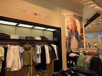 Photo of WARSAW, POLAND - JULY 13, 2022: Stylish interior of Tommy Hilfiger store in shopping mall