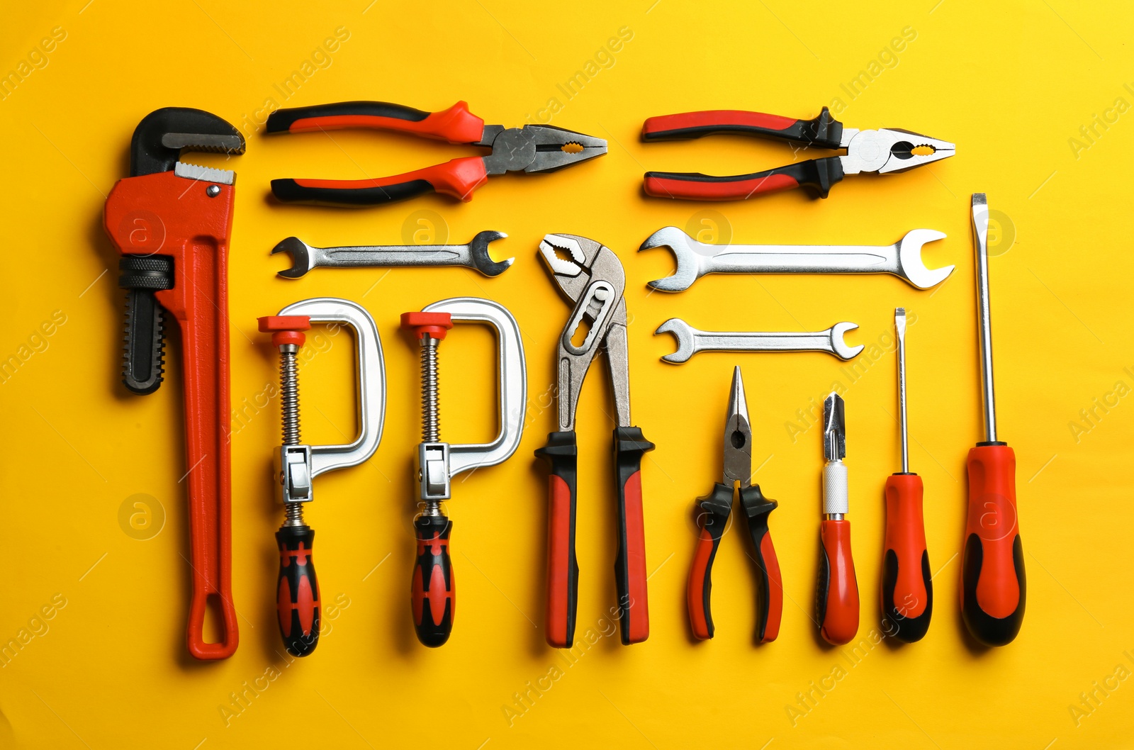 Photo of Flat lay composition with construction tools on color background