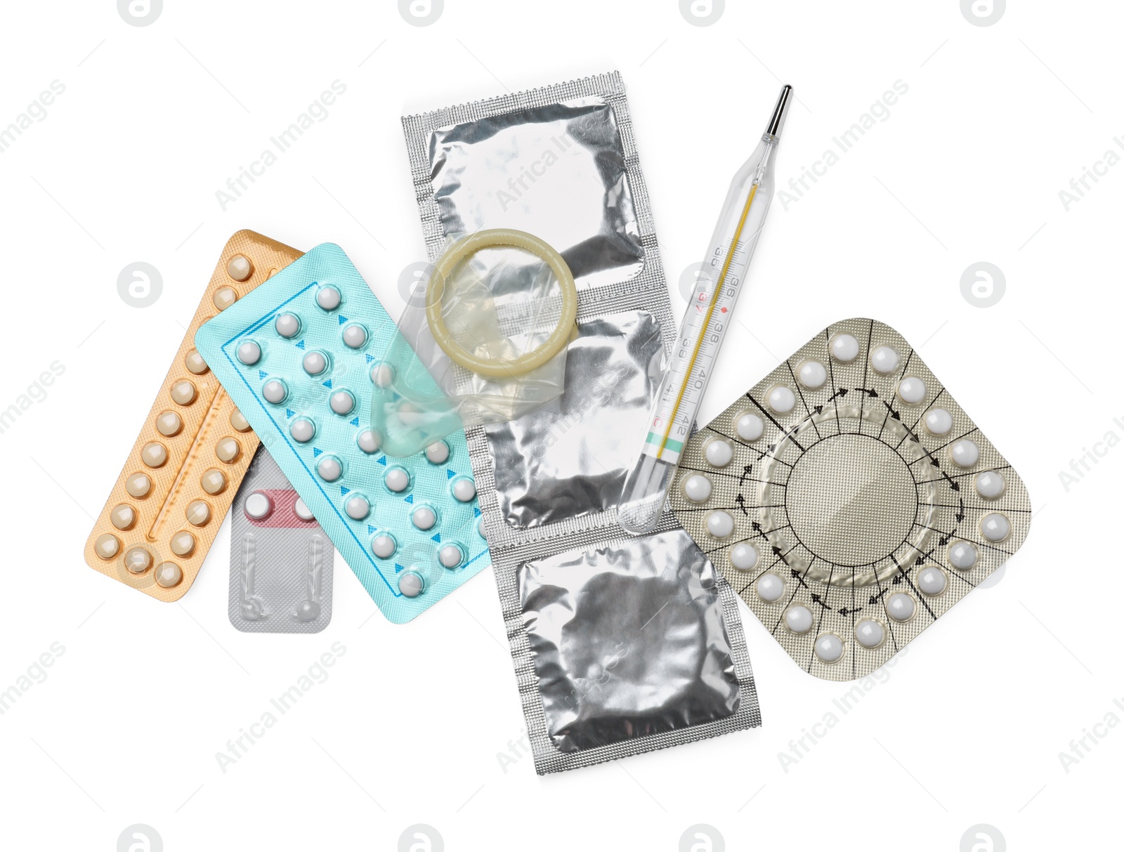 Photo of Contraceptive pills, condoms and thermometer isolated on white, top view. Different birth control methods