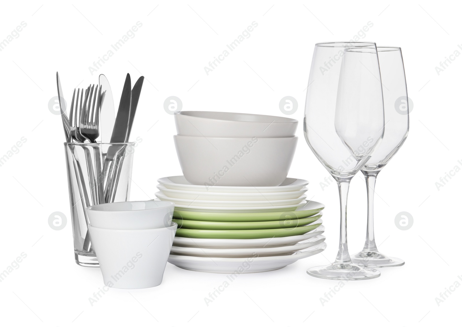 Photo of Set of beautiful ceramic dishware, glasses and cutlery isolated on white