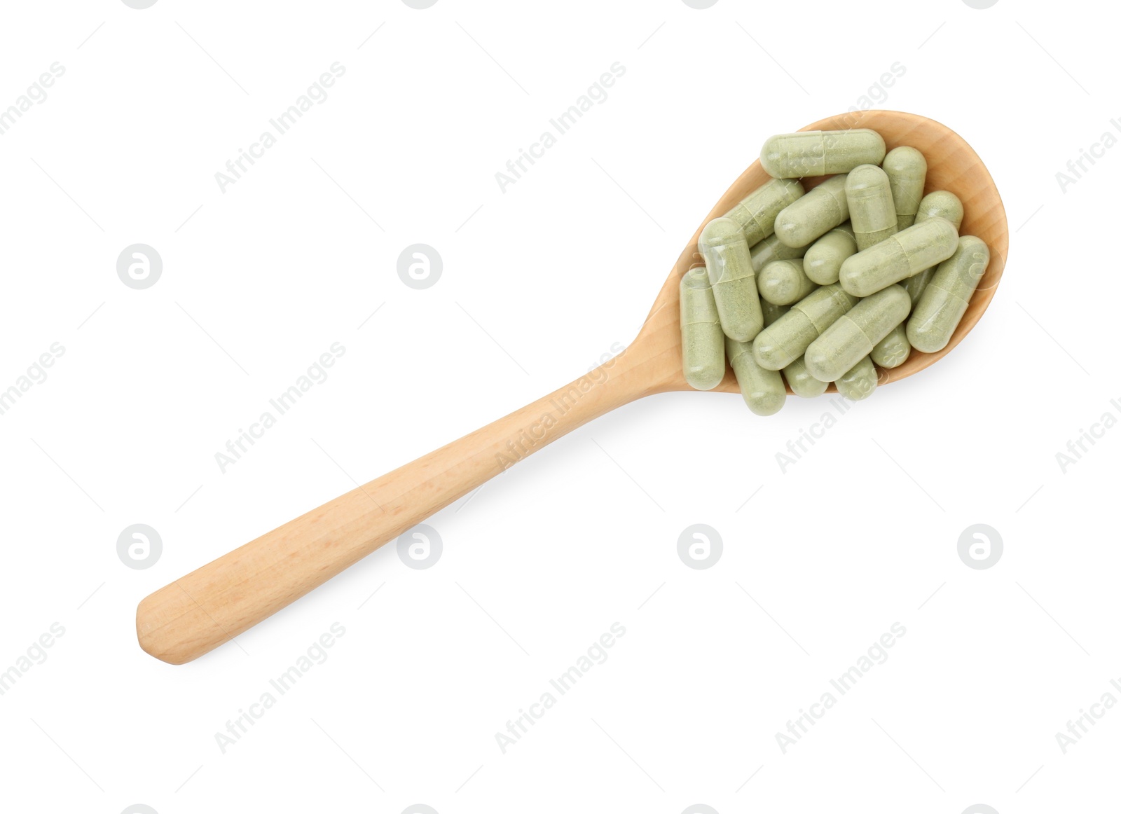 Photo of Vitamin capsules in wooden spoon isolated on white, top view. Health supplement