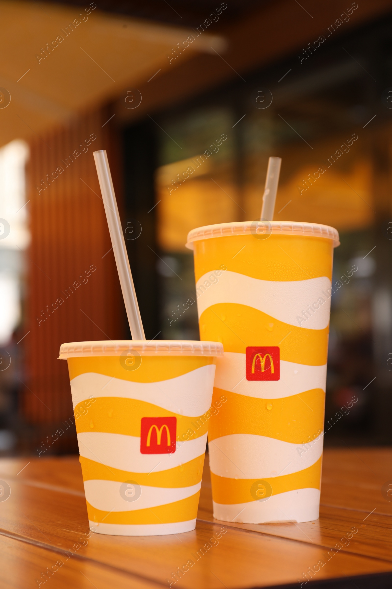 Photo of MYKOLAIV, UKRAINE - AUGUST 11, 2021: Cold McDonald's drinks on table in cafe