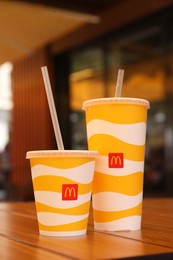 MYKOLAIV, UKRAINE - AUGUST 11, 2021: Cold McDonald's drinks on table in cafe