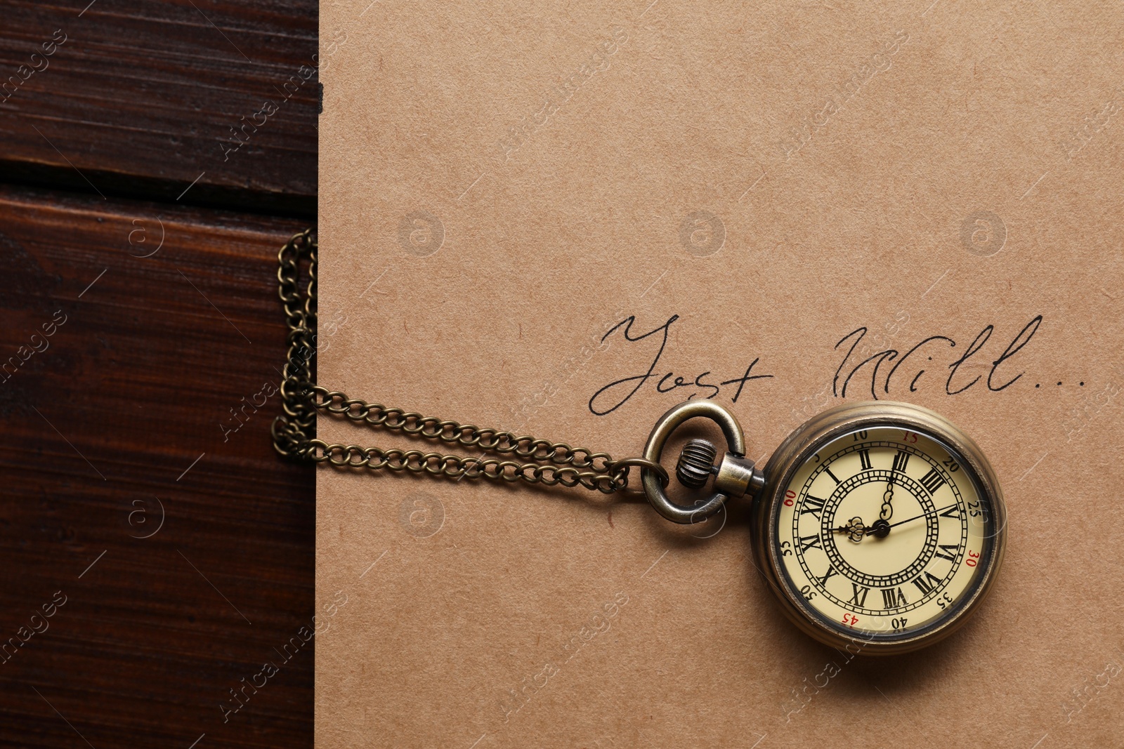 Photo of Paper with words Last Will and pocket watch on wooden table, top view