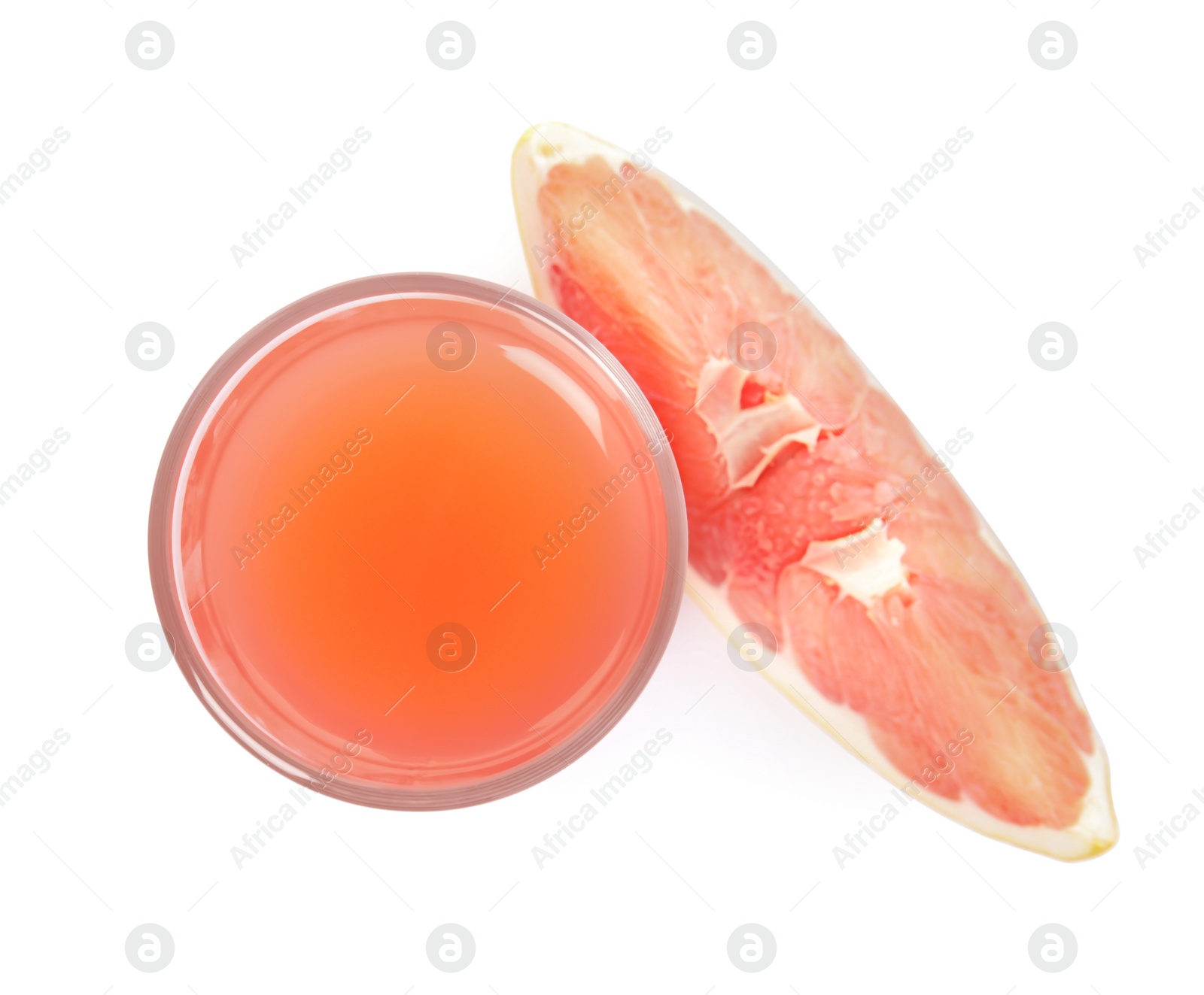 Photo of Glass of pink pomelo juice and fruit isolated on white, top view