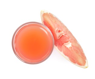 Photo of Glass of pink pomelo juice and fruit isolated on white, top view