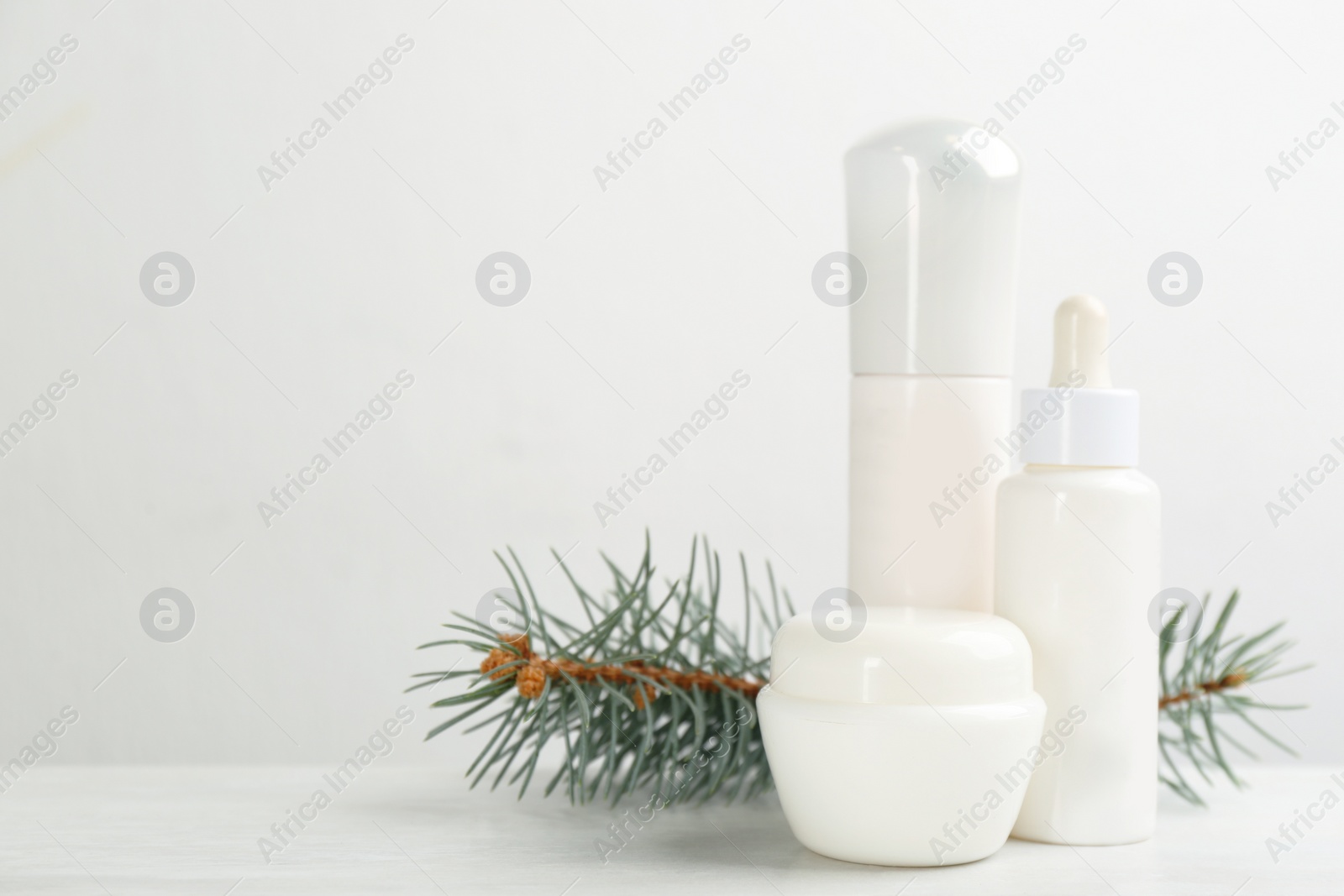 Photo of Beautiful composition with different cosmetic products on white table, space for text. Winter care