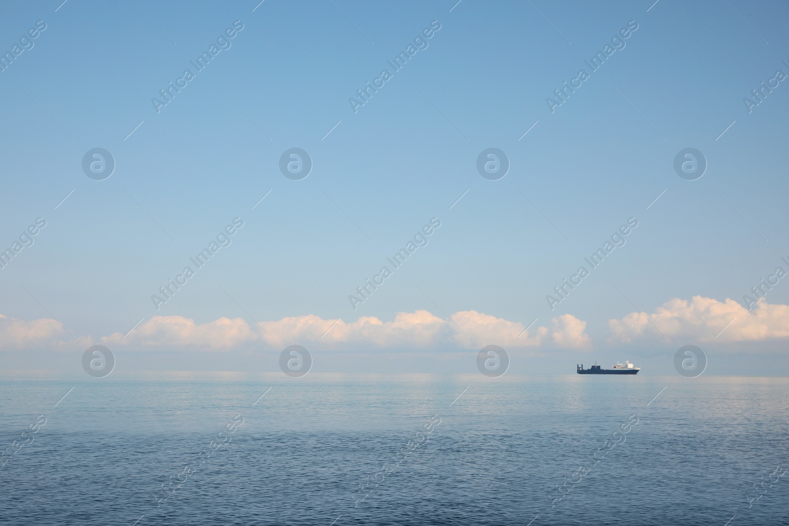 Photo of Beautiful view of tranquil sea and vessel on summer day