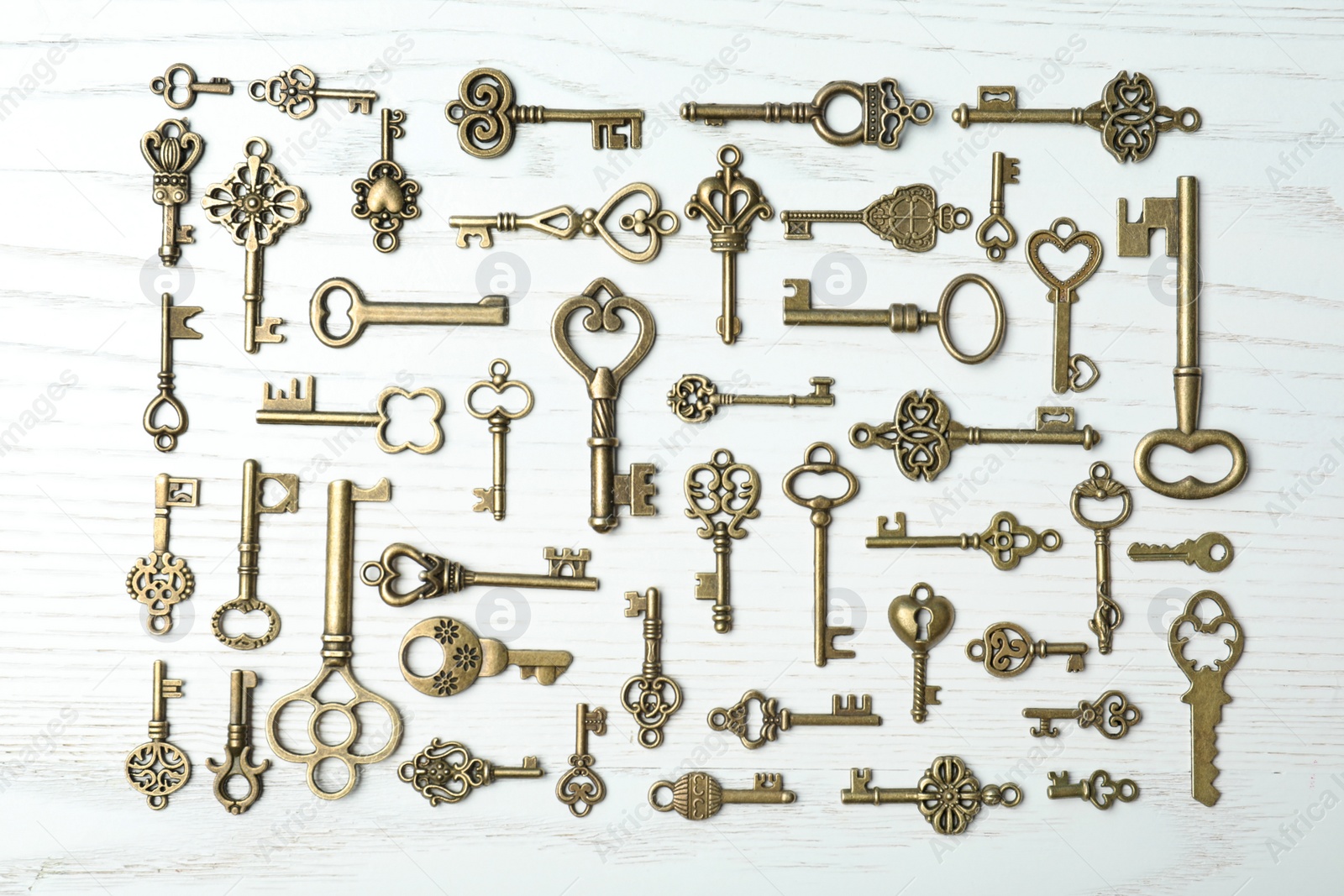 Photo of Flat lay composition with old vintage keys on wooden background
