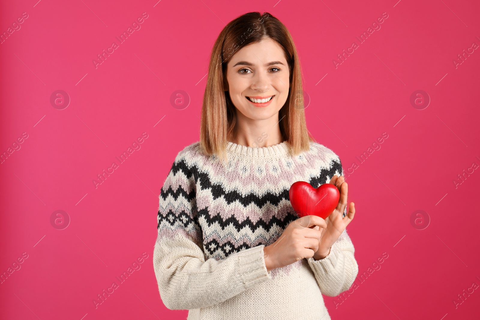 Photo of Portrait of woman with decorative heart on color background