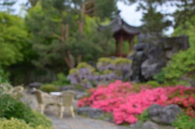 Photo of Blurred view of beautiful oriental gazebo in park