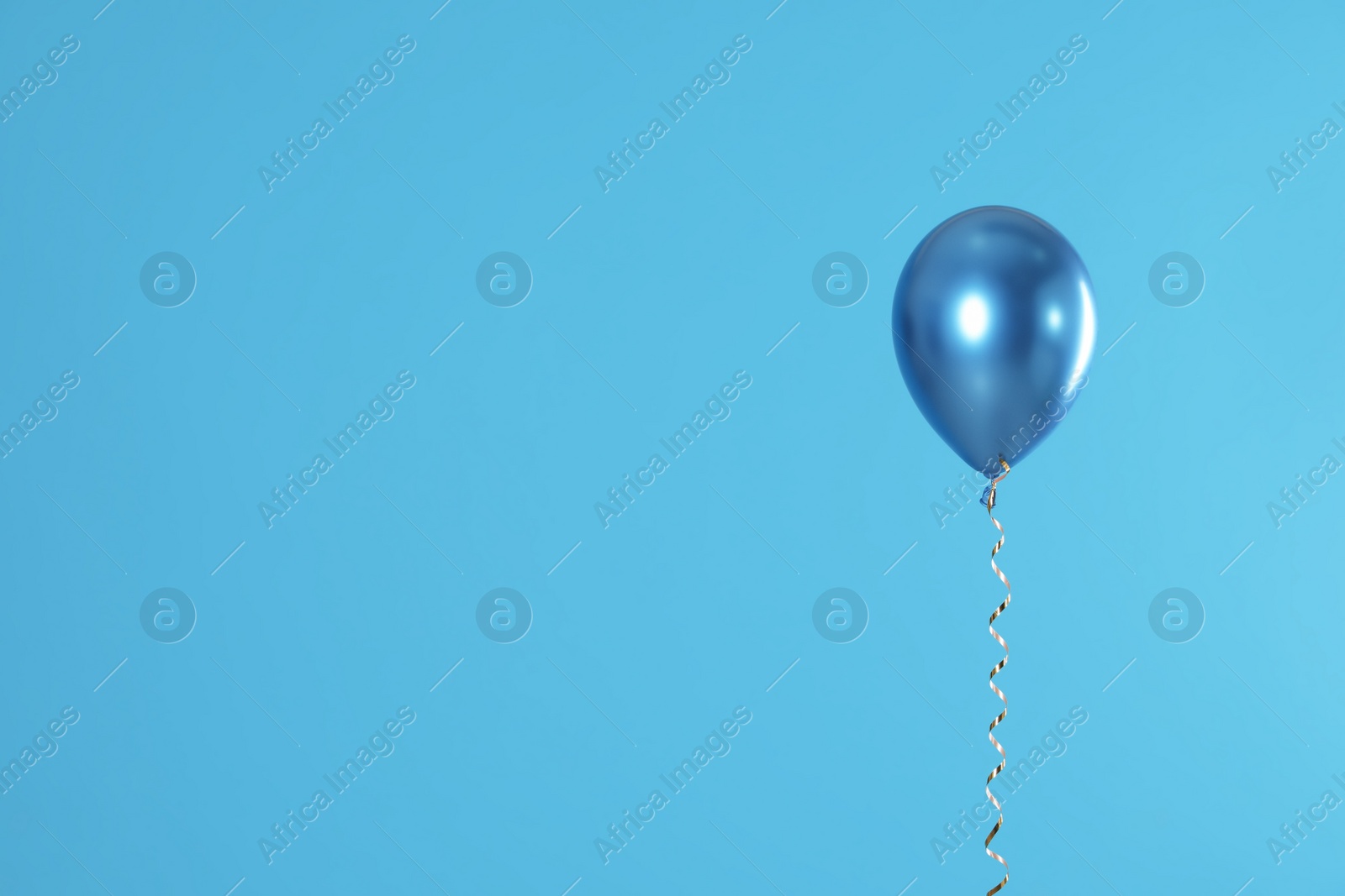 Photo of Bright balloon on color background. Space for text