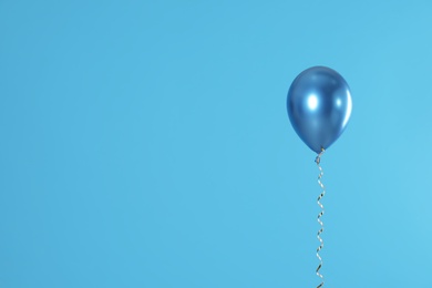 Photo of Bright balloon on color background. Space for text