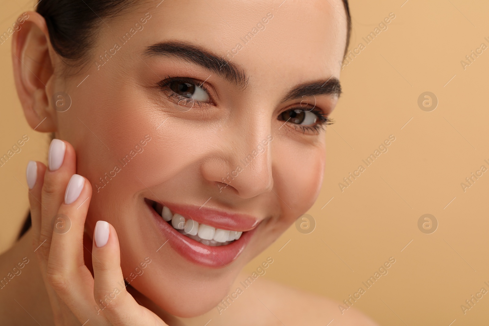 Photo of Beautiful woman with healthy skin on beige background, closeup. Space for text