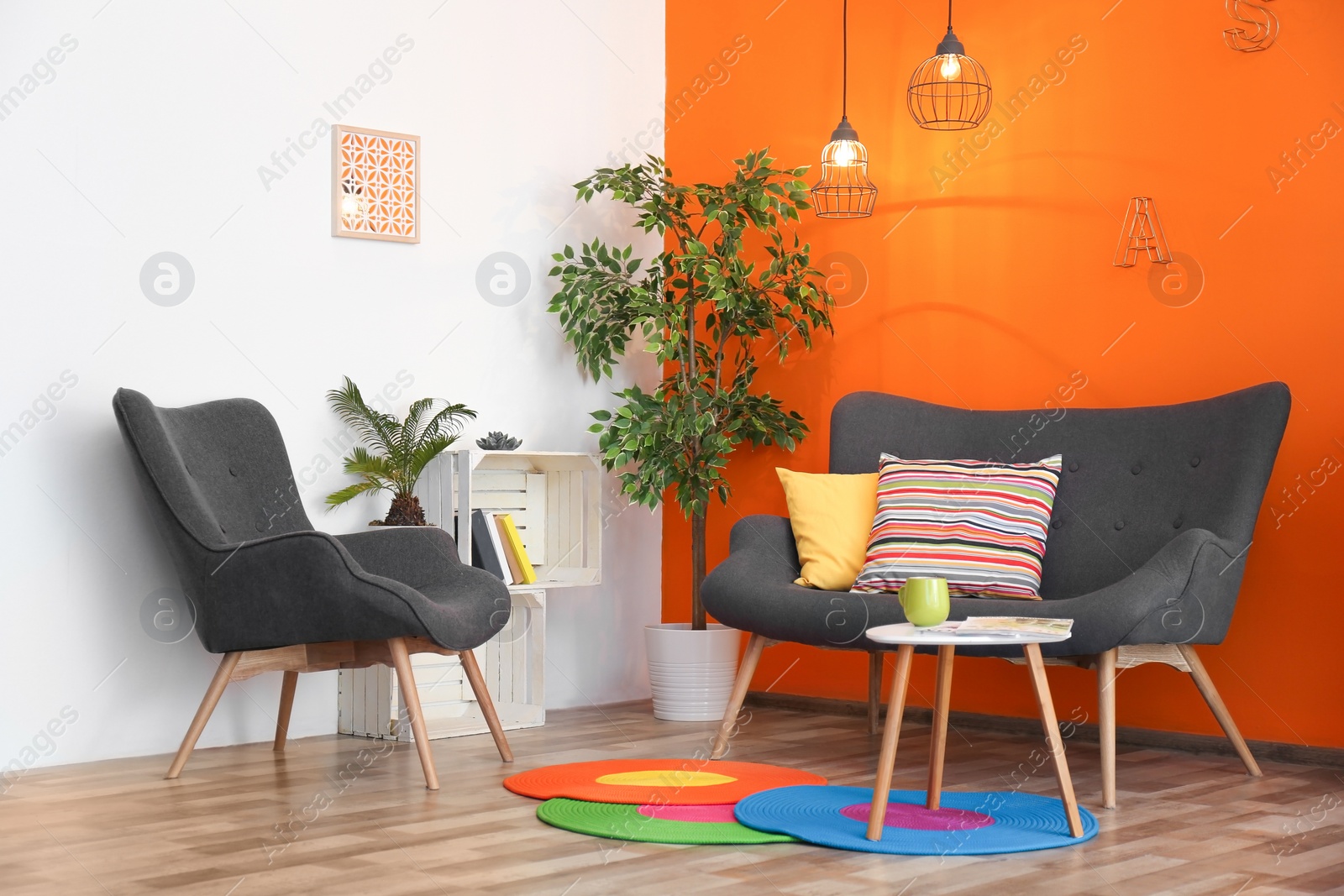 Photo of Interior of modern living room with pillows on sofa