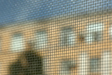 Closeup of mosquito window screen, view from inside