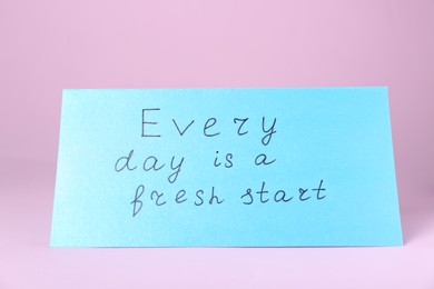 Photo of Card with phrase Every Day Is A Fresh Start on pink background. Motivational quote