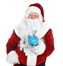 Photo of Santa Claus holding piggy bank with dollar banknotes on white background