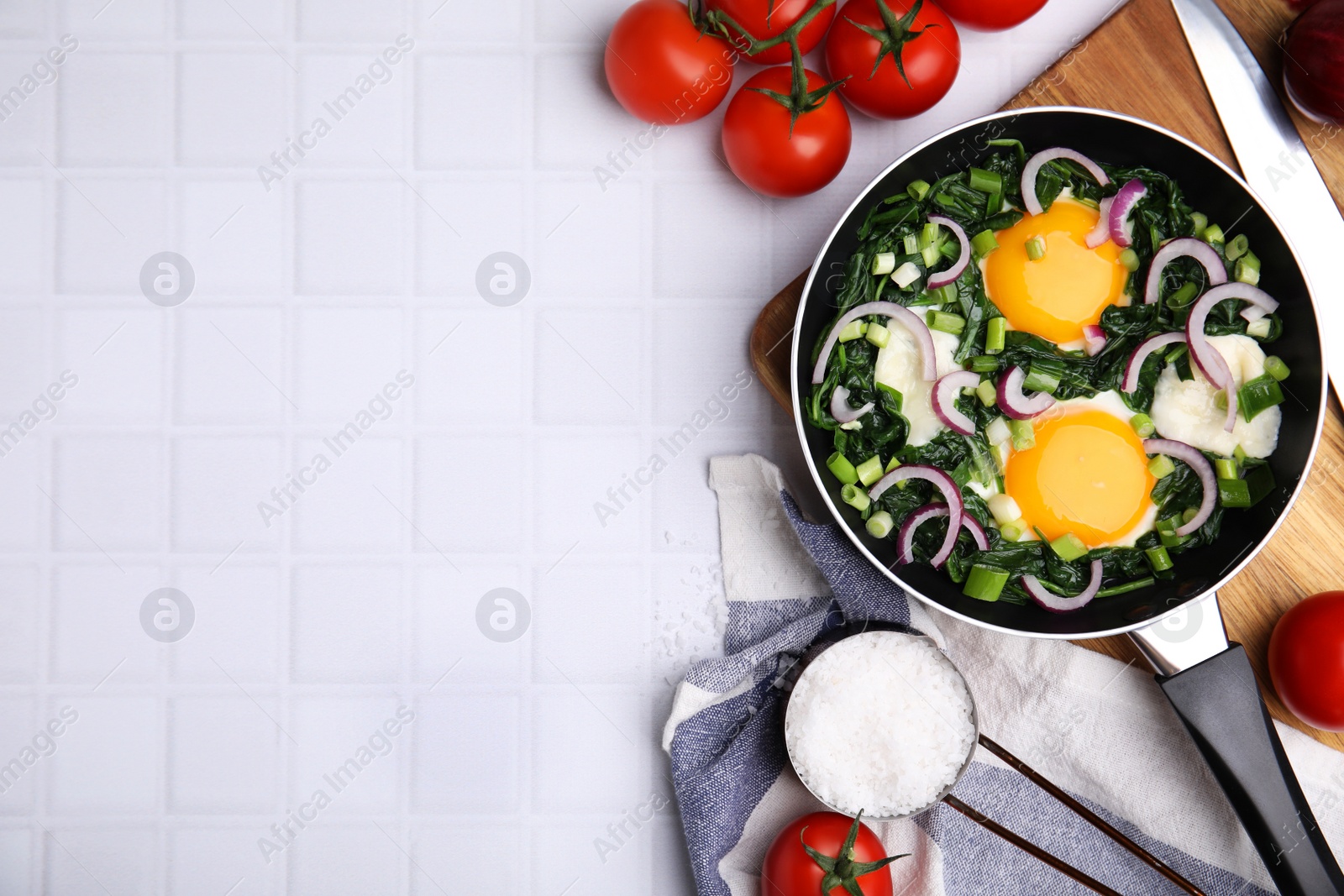 Photo of Flat lay composition with tasty Shakshouka and ingredients on white table. Space for text