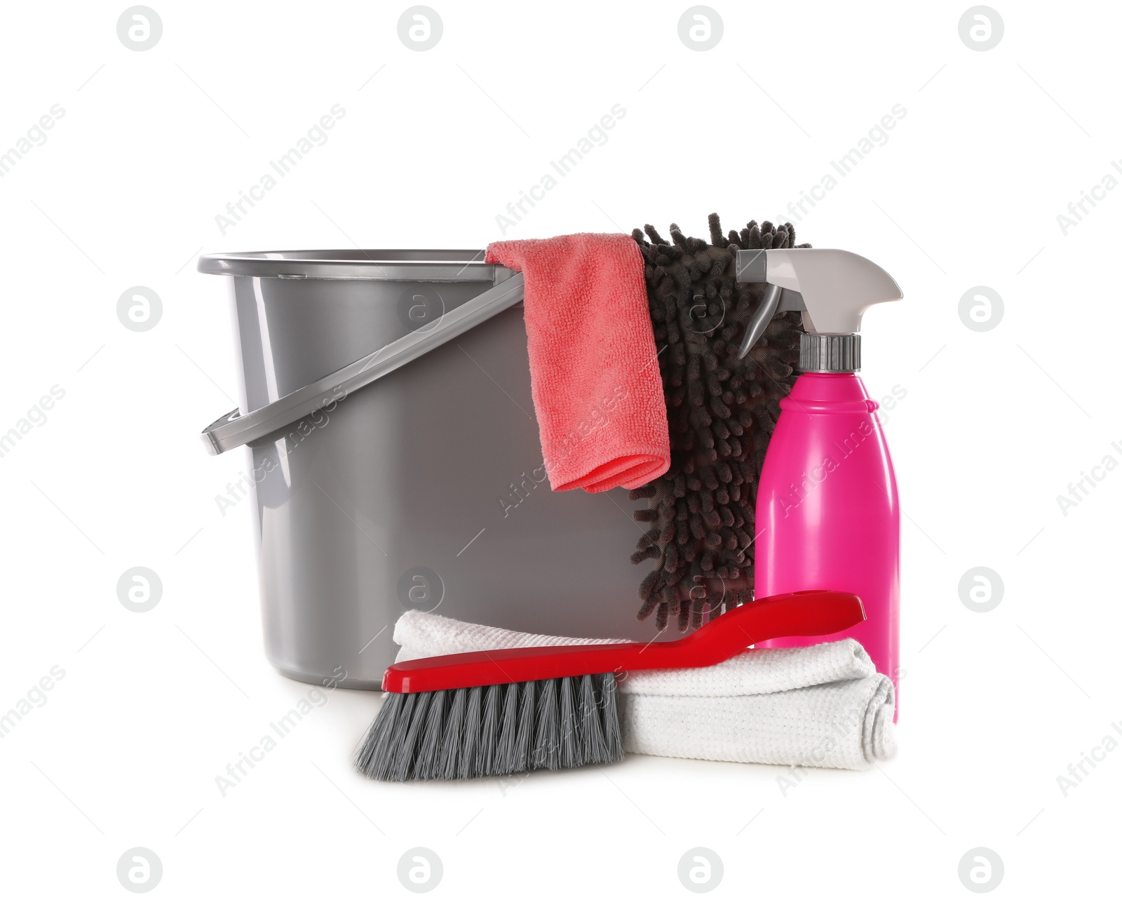 Photo of Plastic bucket with different cleaning supplies isolated on white