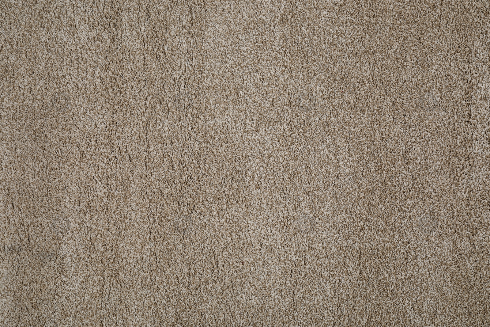 Photo of Stylish soft beige carpet as background, top view