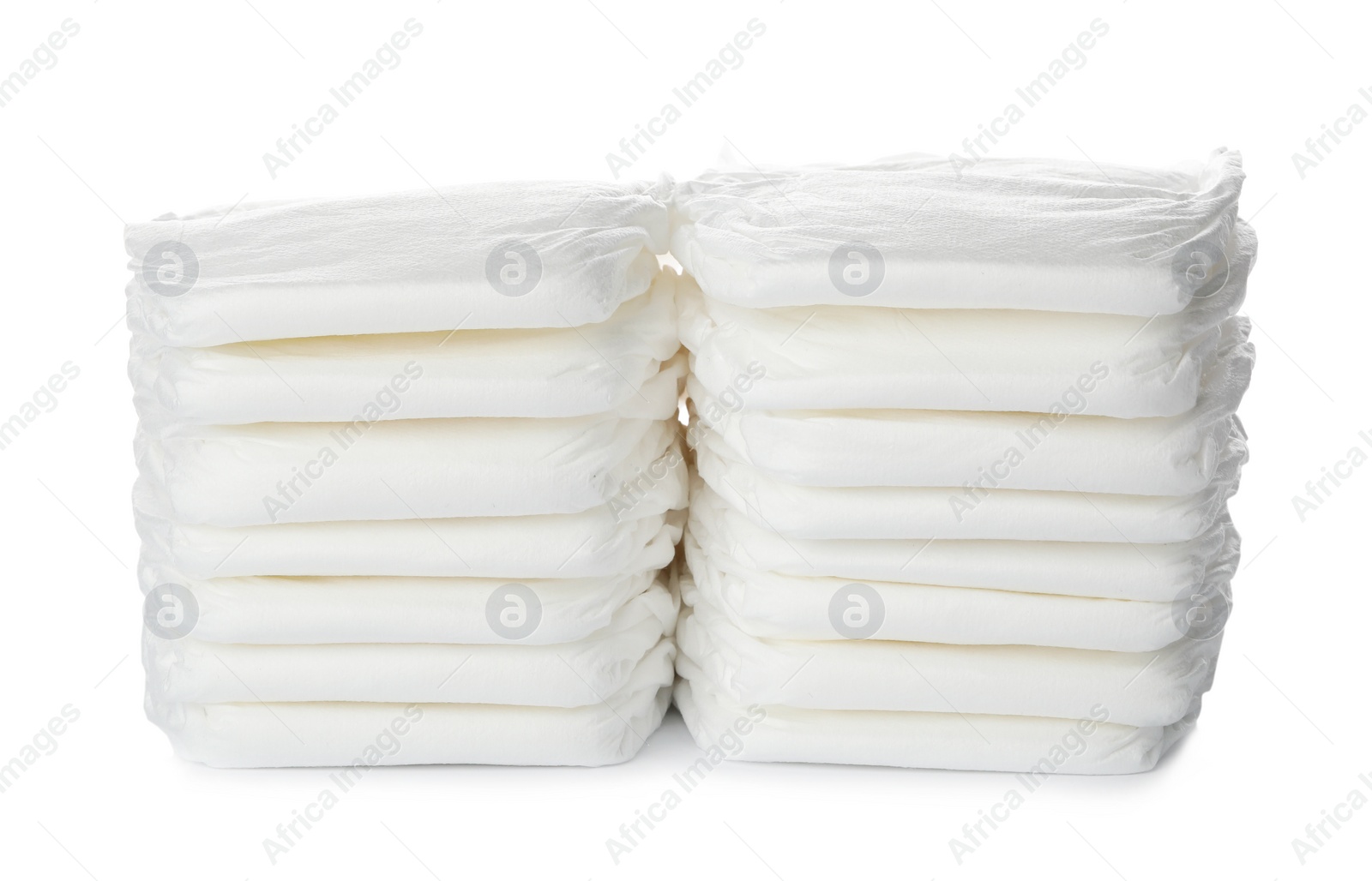 Photo of Stacks of baby diapers isolated on white