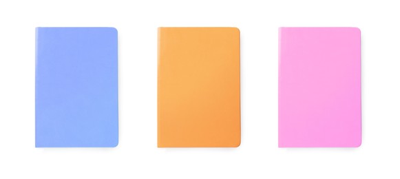 Set with multicolor notebooks on white background, top view. Banner design