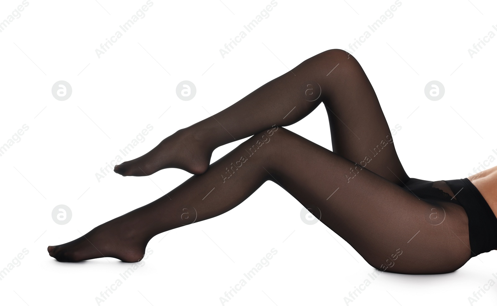 Photo of Woman with beautiful long legs wearing black tights on white background, closeup