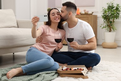 Photo of Affectionate young couple spending time together at home