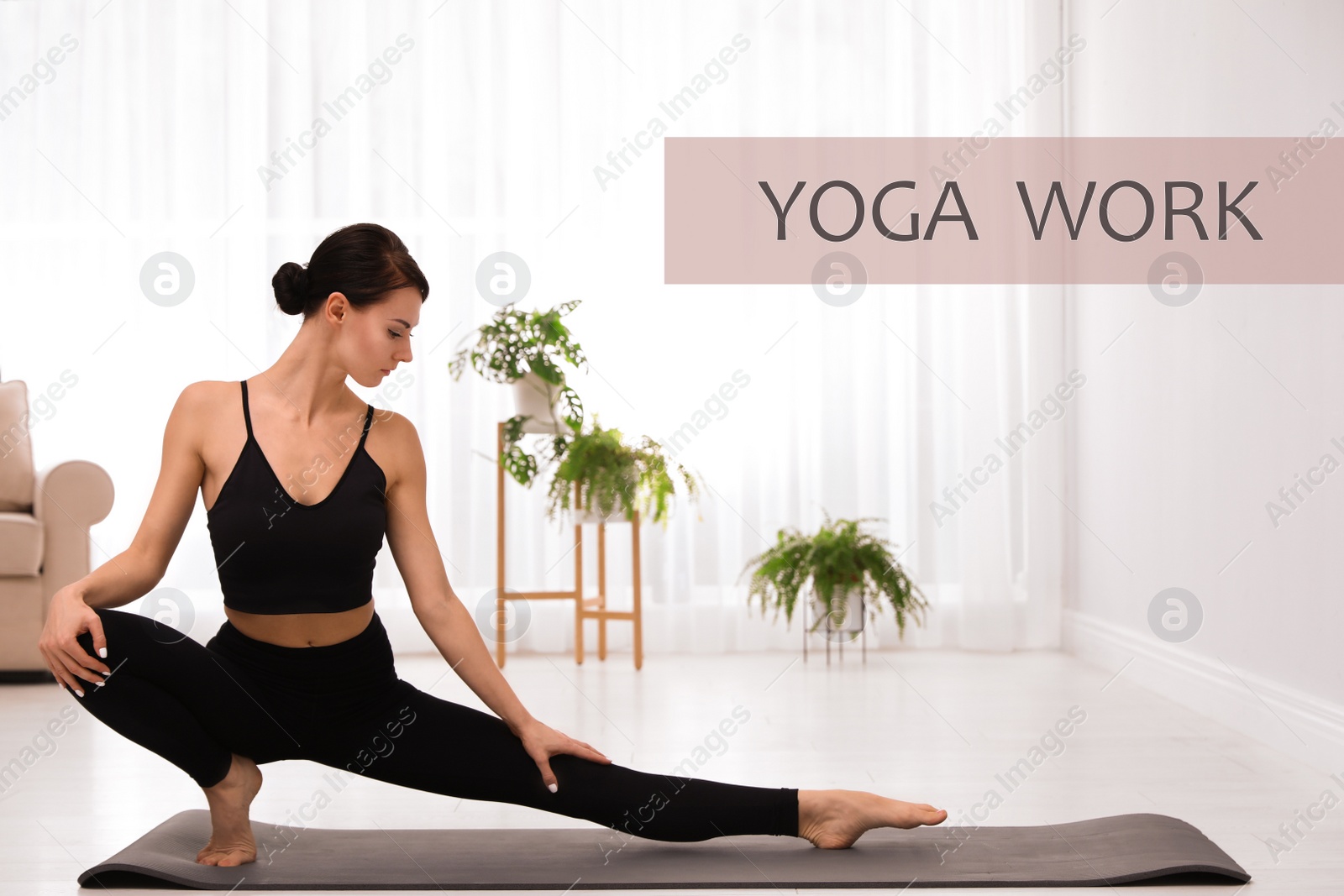 Image of Young woman in sportswear practicing yoga at home