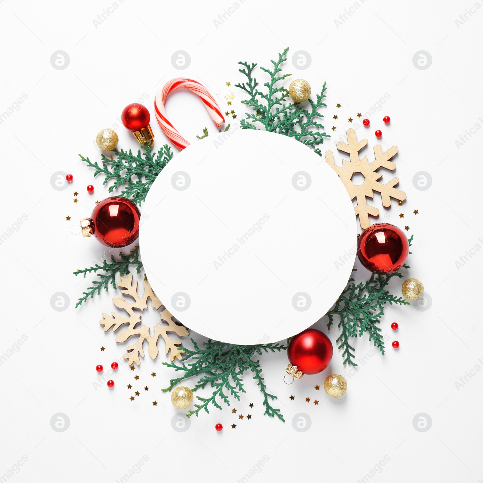 Photo of Flat lay composition with Christmas decor and blank card on white background. Space for text