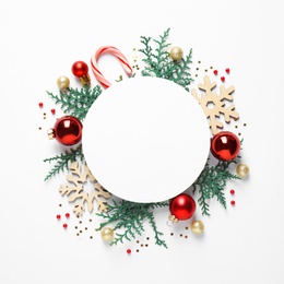 Flat lay composition with Christmas decor and blank card on white background. Space for text