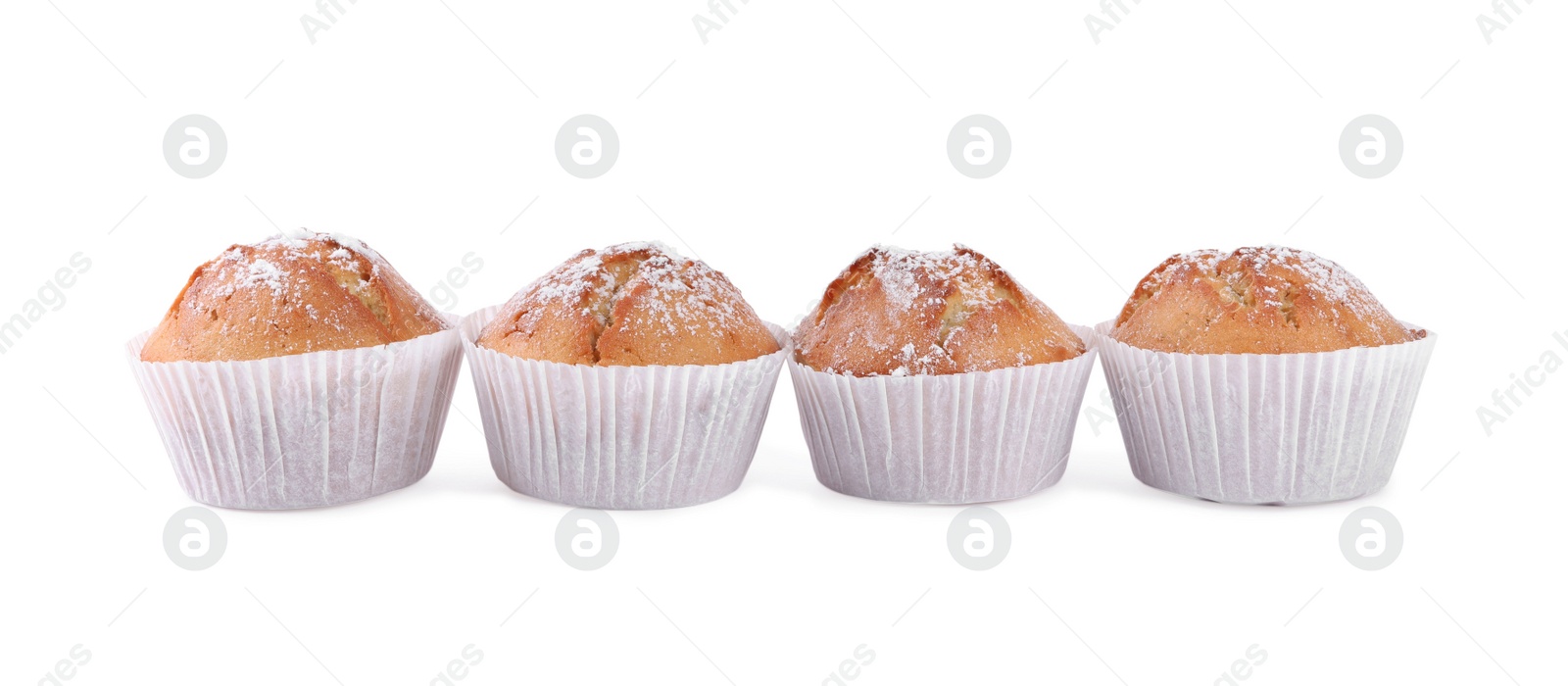 Photo of Tasty muffins powdered with sugar on white background